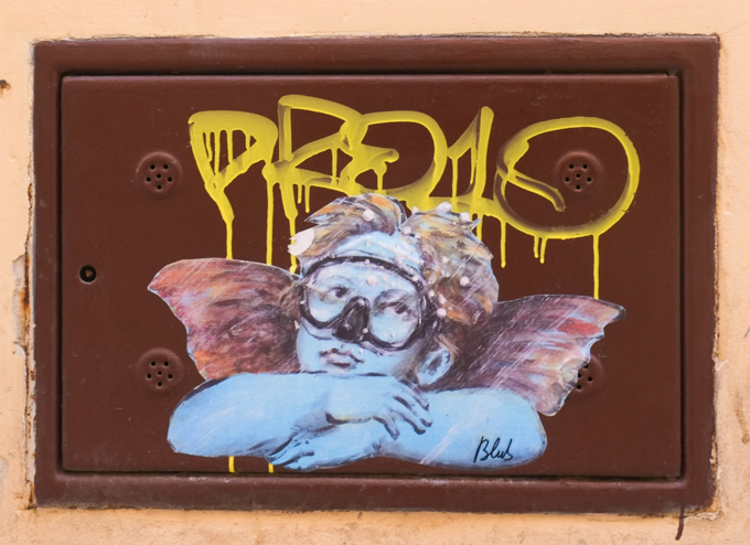 street art by blub, his underwater series, famous little angel with arms crossed in front of him, now blue and wearing diving mask