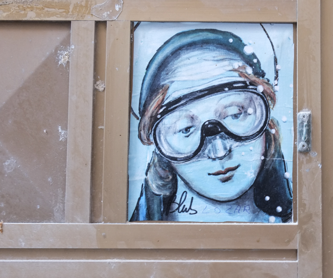 street art by blub, his underwater series, famous woman's face now blue and wearing diving mask, virgin mary, or the madonna