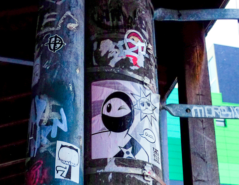 visual noise, and urban ninja squadron black and white paste up on a pole