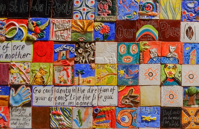hand decorated ceramic tiles arranged in a mosaic as street art on a building in a park in Port Phillip Australia,