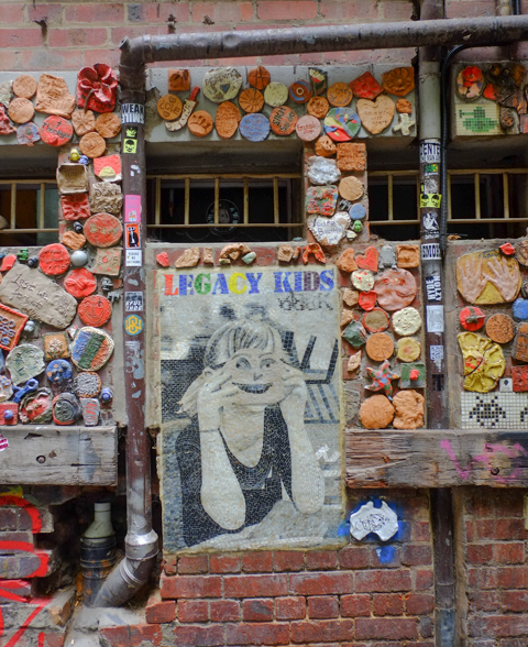 wall behind Legacy House decorated with ceramic tiles that have been made by legacy participants