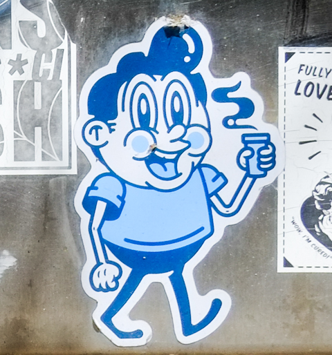 little blue and white graffiti sticker, man walking while holding a cup with steam coming off of it