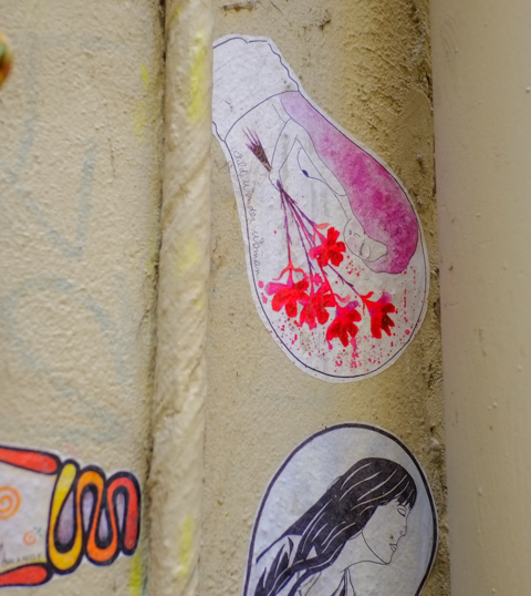 paper pasteup on yellow wall, shape of a light bulb,