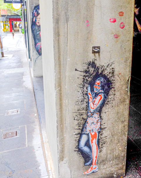 street art image of a young woman, standing, 