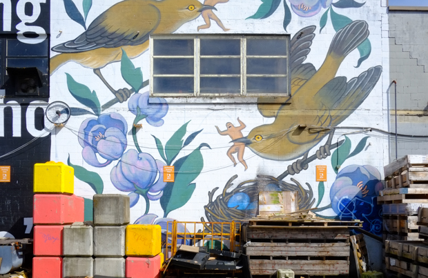mural from 2016 Vancouver Mural Festival, birds, a nest, some flowers and some small scale naked men