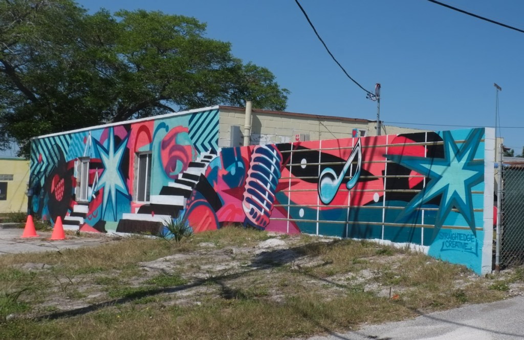 mural in bright colours, music theme, microphone, record album, by straight edge creative