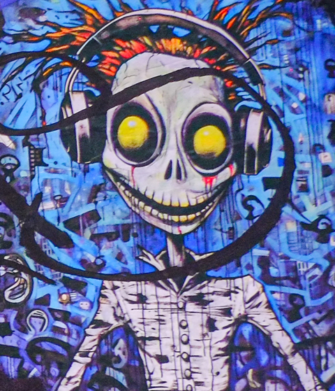 graffiti, image of skinny alien-like character with big yellow eyes, spikey hair, wearing headphones