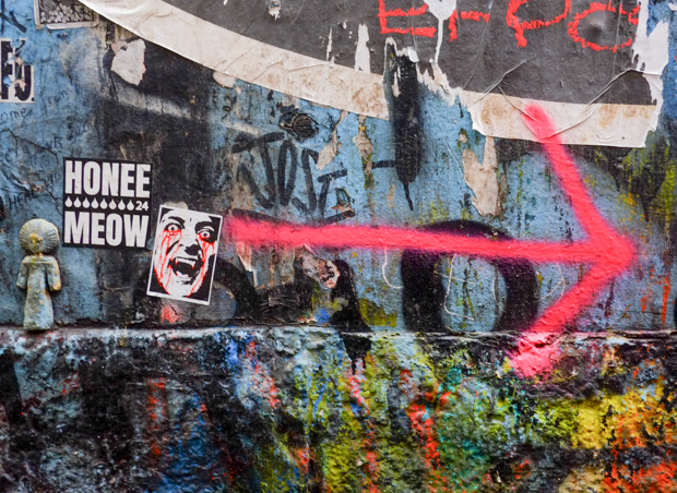 pink spray paint arrow pointing right