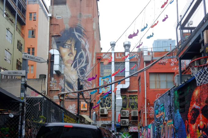portrait of a woman, surround by wispy feathers, high on a brick wall, by adnate and shida