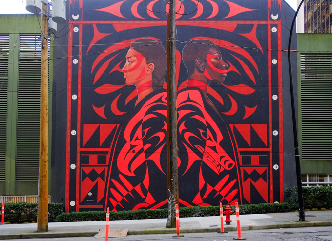 large red and black mural by Lauren Brevner and James Nexw'Kalus-Xwalacktun Harry , James Harry, title Dreamweaver, two figures standing back to back