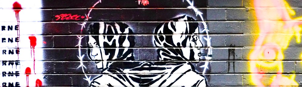 double headed astronaut black and white stencil street art