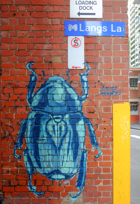 street art painting of a very large blue insect or beetle in Langs Lane, Melbourne