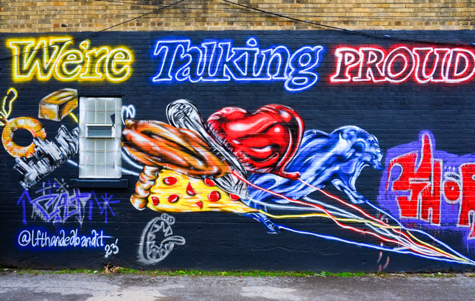 we're talking proud mural in an alley buffalo, balloons on strings being pulled, by left handed bandit