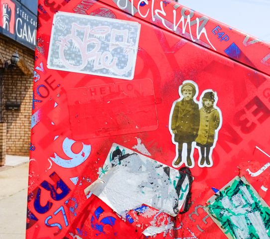 stickers on the side of a Canada Post mailbox