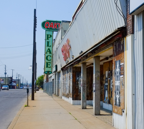 portion of Barton Street, building once known as Oakwood Place, and included a shoe store, now empty and boarded up. 