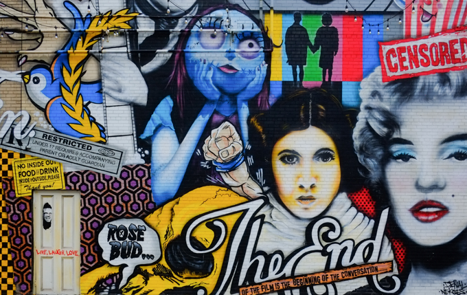  Princess Leia from Star Wars, Marilyn Munroe, Rosebud, The End, censored, fist from Superman, Jack Nicholson's head on door, all in movie themed mural by Denial