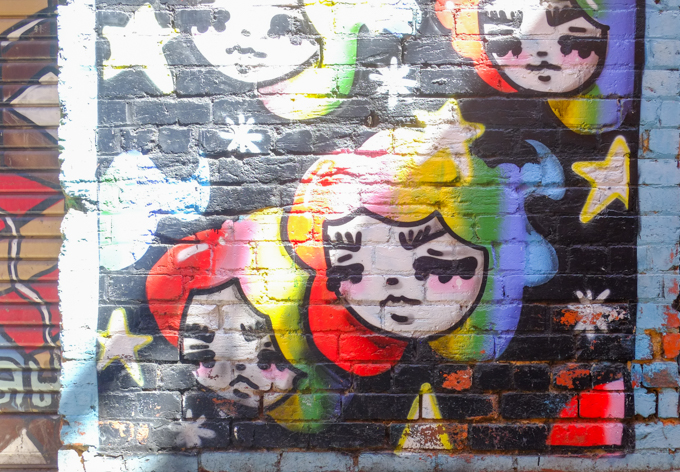 mural in Whitehart Lane, young girls faces, stars