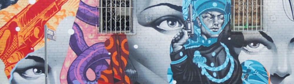 part of a mural in downtown Los Angeles with lots of womens faces