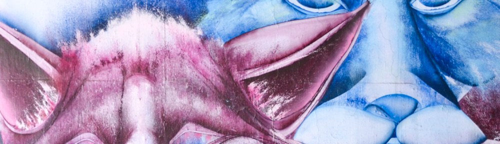 two pairs of animal eyes, one in blue and the other in red and pink, part of a street art mural by christopher Ross, gawd,