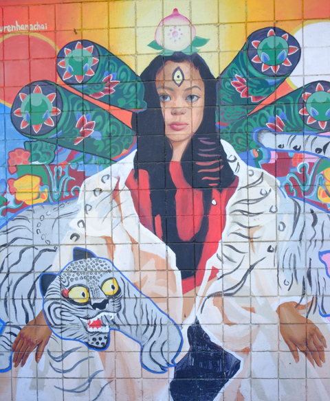 mural in Honolulu by Lauren Hana Chai, realistic woman's face