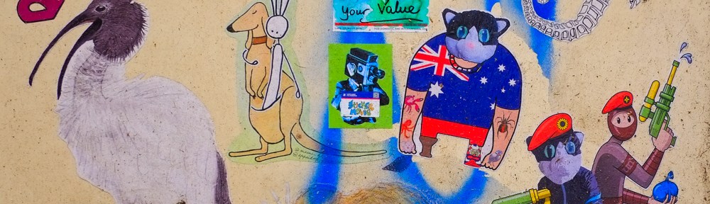 slaps, stickers, and paste ups on a yellow door in Baptist Place, Melbourne, including a kangaroo, an urban ninja squadron,