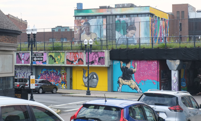 street art murals in Lynn Mass USA, under the railway that runs above grade here, as seen from  beyond Mount Vernon Street