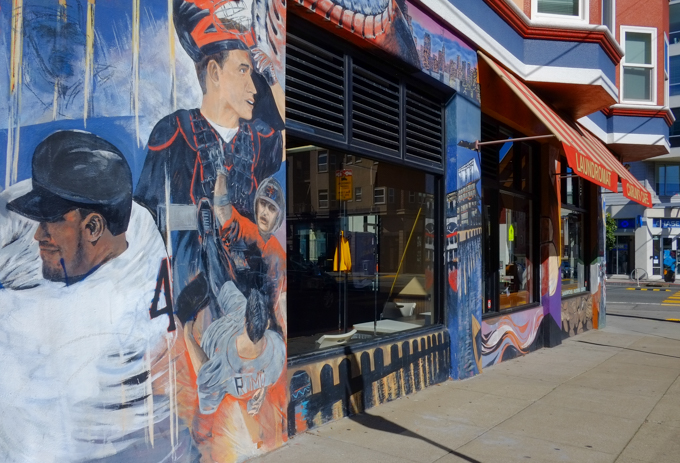 carlins cafe, exterior wall with large windows, paintings on the walls, 