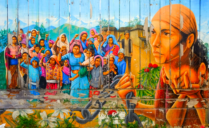 part of Three generations of women working in Nepal are depicted in this mural by Martin Travers. "Naya Bhinana" (A New Dawn) was painted in 2002.