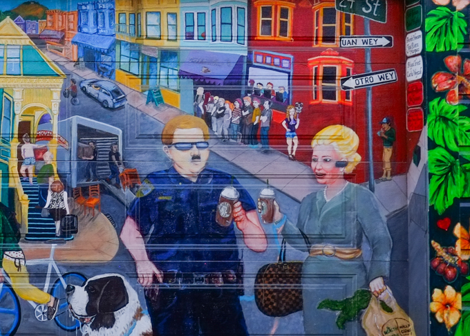 Balmy Alley mural, social commentary, social justice, theme of gentrification effects on Mission District, painted originally in 2012 by Tirso Araiza and Lucia González Ippolito, updated in 2022, shows police removing people from the area, wealthier people moving in