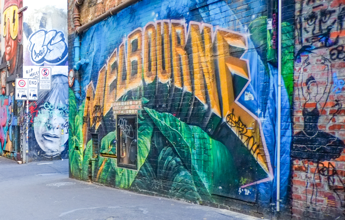 street art in ACDC lane, central Melbourne, The word Melbourne in gold letters, beside a drawing of a ballerina