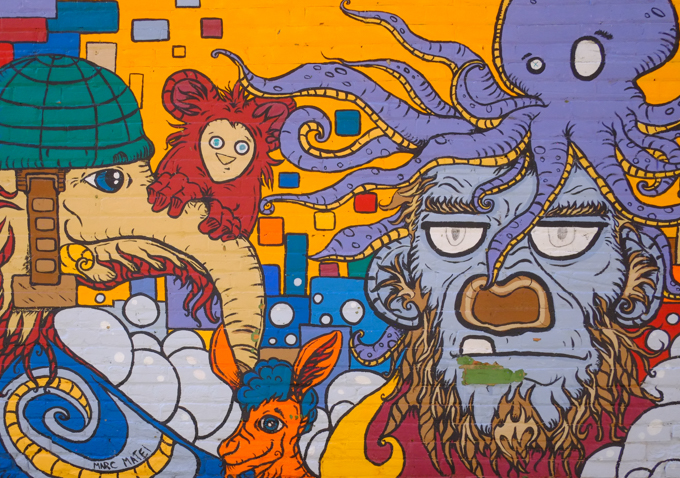street art mural, purple octopus, orange donkey, man with beard,