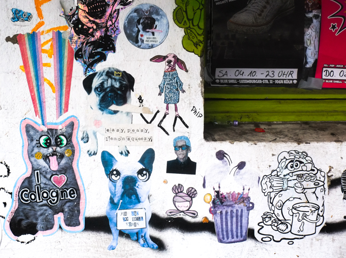 paper paste-ups graffiti  on a wall in cologne