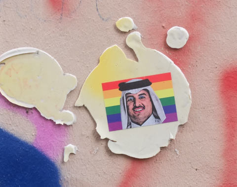sticker, rainbow, with an Arab man's head on it