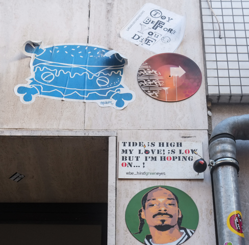 spam is the signature on blue graffiti, text graffiti by behind green eyes that says The tide is high my love is low but I'm hoping on, other text graffiti that says try before you die. 