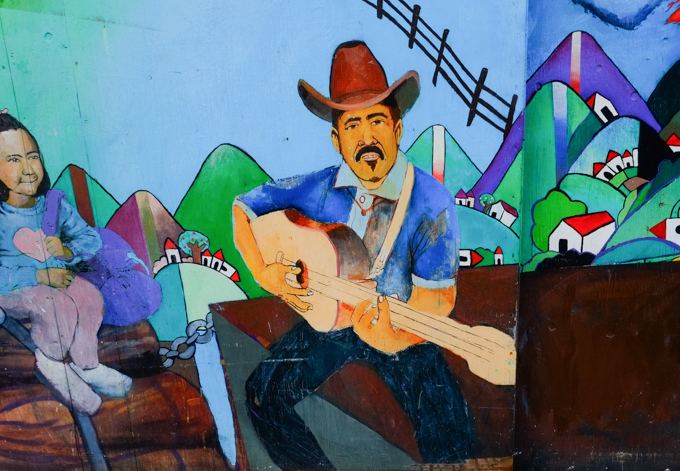 mural by Josue Rojas in Balmy Alley San Francisco, man playing guitar