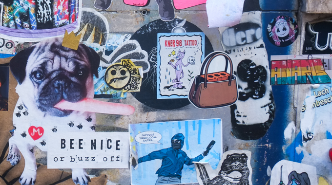 slaps and wheatpaste on a wall in the Belgian quarter of Cologne