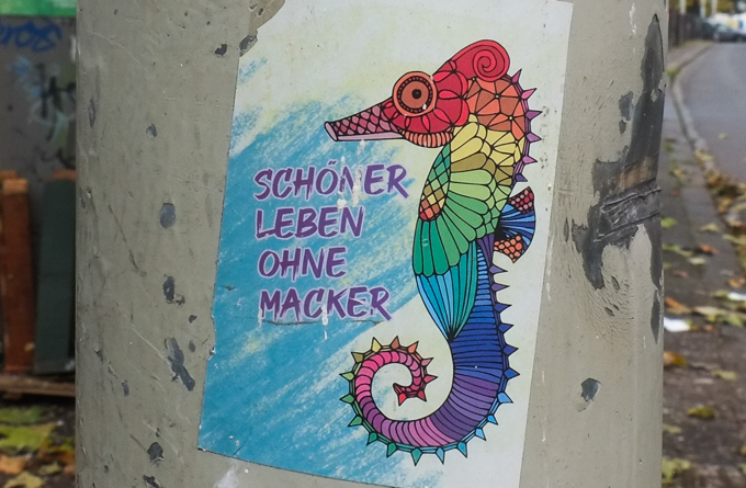 small paste-up, seahorse in rainbow colours with words schoner leben ohne macker