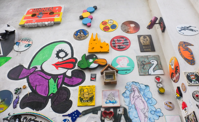 slaps, stickers, and other pasteups on a wall Heliosstrasse in Cologne