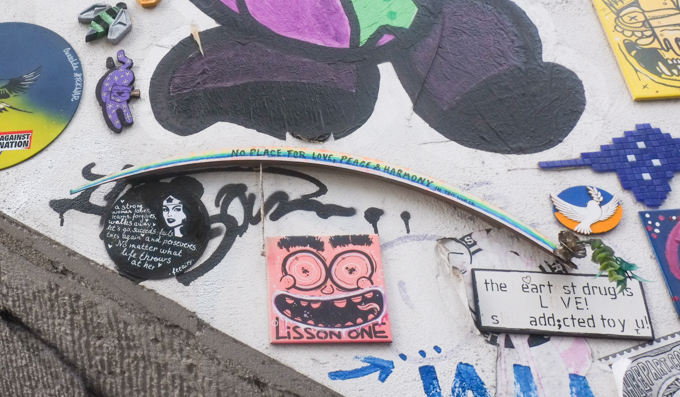 slaps, stickers, and other pasteups on a wall Heliosstrasse in Cologne