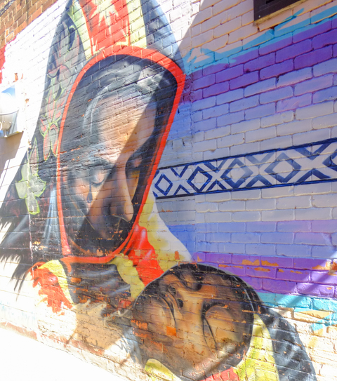 part of a mural in Owen Sound, Mexican theme, woman holding a child, by Billy Goodkat and students from local high schools