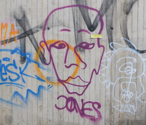 street art on Hochstadenring in Bonn Germany, purple line drawing of a face
