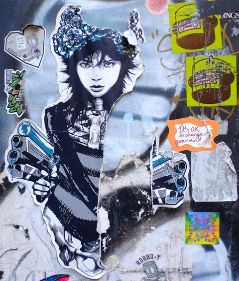 paste-up of a young woman and her guns by Tinkerstumpf