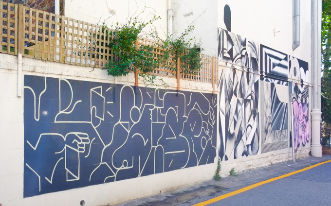 part of encrypto project number two,black and white abstract paintings on a wall in Abbotsford, by URSH, Brody X, Fikaris, and Baxter