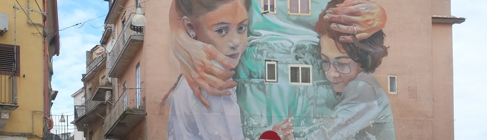 part of a mural by Case Maclaim in Ragusa, of two kids with their mother