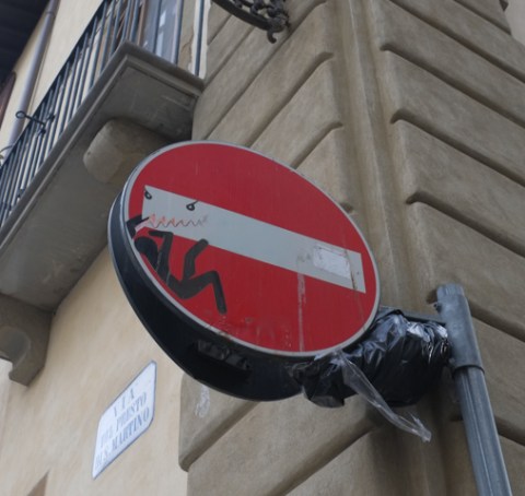 modified traffic sign, graffiti, by Clet Abraham, in Florence,