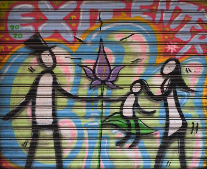 painting on metal door covering, by exit enter, a family of three