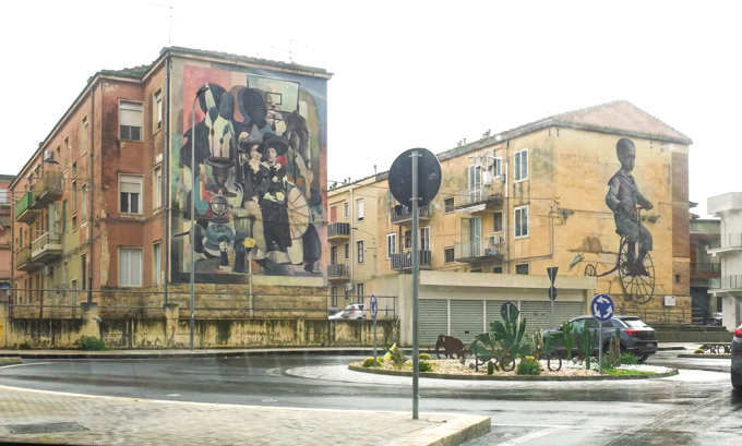 il tempo paso, two murals on the ends of adjacent buildings in Comiso Italy