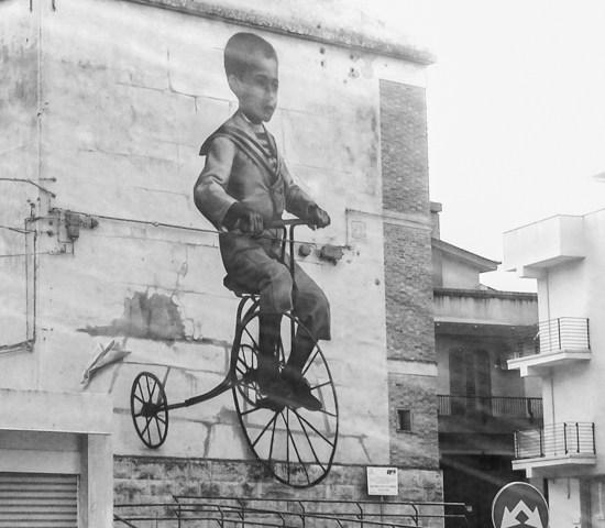 black and white version of case maclaim mural of boy on a bicycle