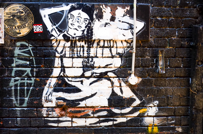 paste up graffiti, large piece, woman with two heads