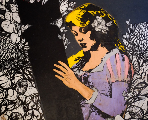 street art, urban art, a woman holds a black silhouette of a bomb